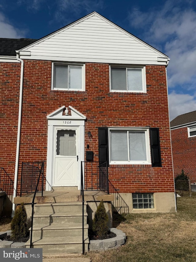 view of front of house with brick siding