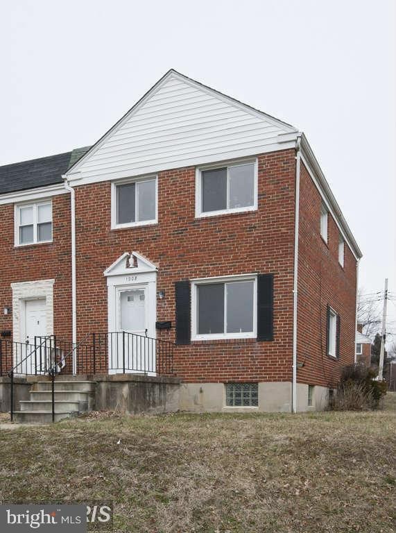 view of front of house featuring brick siding