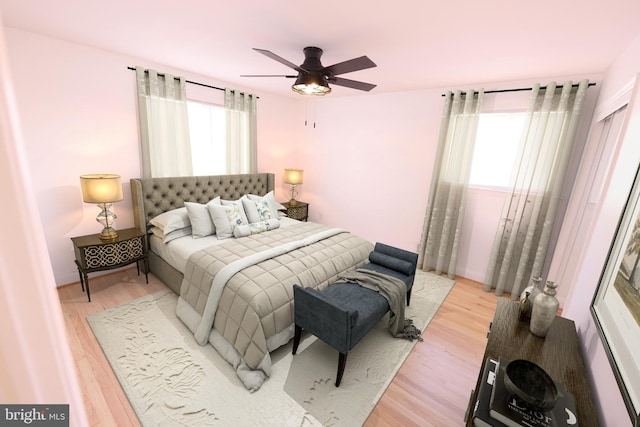 bedroom with baseboards, a ceiling fan, and light wood-style floors