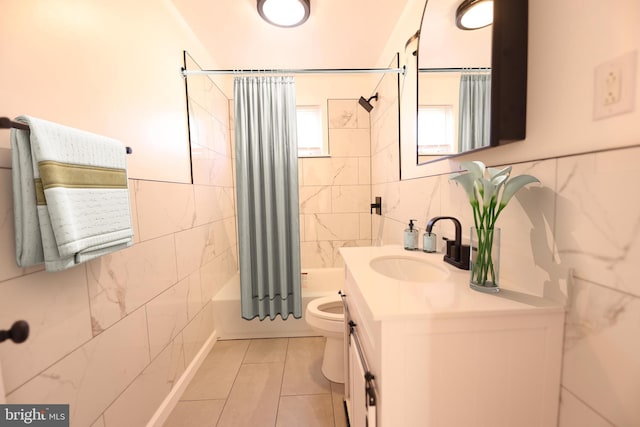 bathroom featuring vanity, tile walls, shower / bath combination with curtain, and toilet