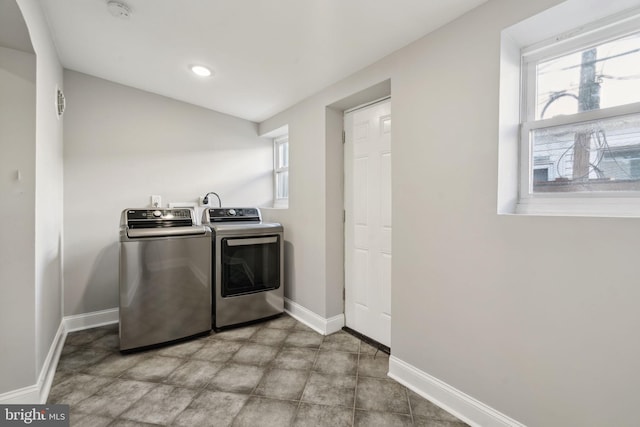 washroom featuring washing machine and clothes dryer