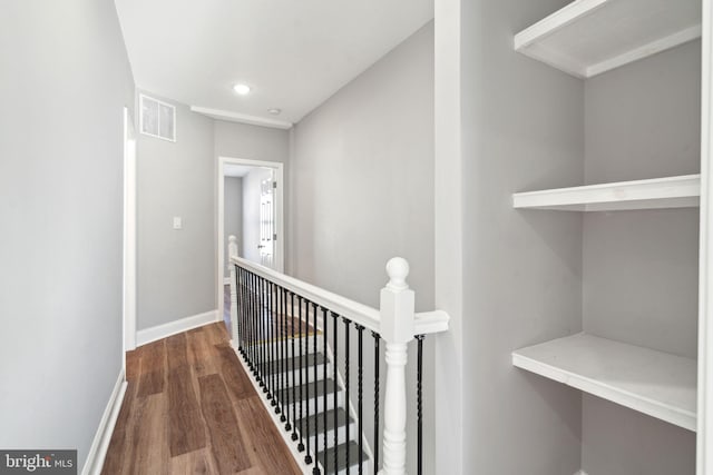 corridor featuring dark hardwood / wood-style floors