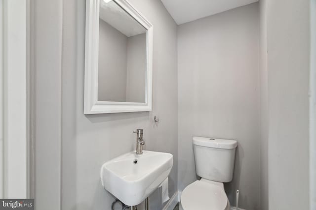 bathroom with sink and toilet