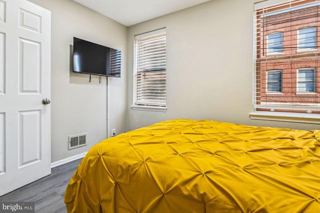 bedroom featuring dark hardwood / wood-style floors