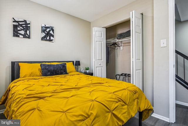 bedroom featuring a closet and dark hardwood / wood-style flooring