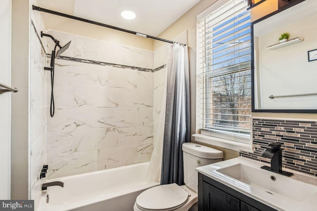 full bathroom with shower / bath combo with shower curtain, backsplash, toilet, and vanity