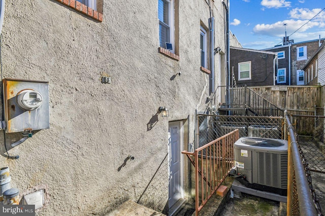 view of home's exterior with central AC unit