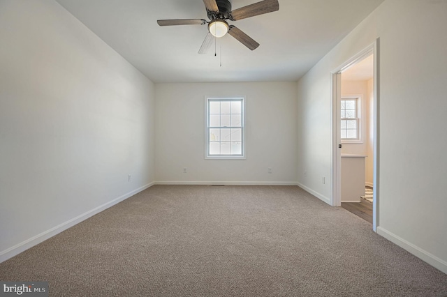 unfurnished room with carpet and ceiling fan