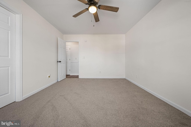 spare room with carpet and ceiling fan