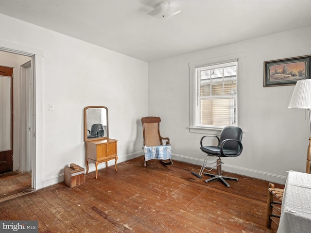 sitting room with wood-type flooring