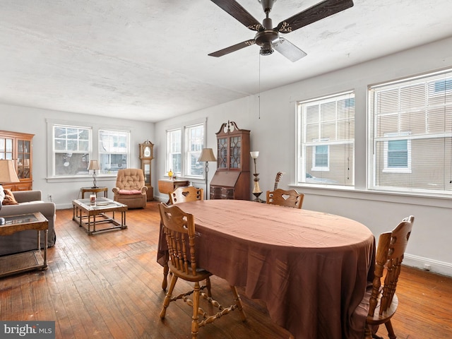 dining area featuring ceiling fan and hardwood / wood-style floors