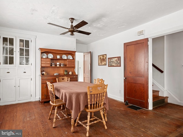 dining room featuring ceiling fan and dark hardwood / wood-style flooring