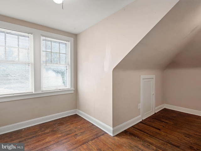 bonus room with dark hardwood / wood-style flooring