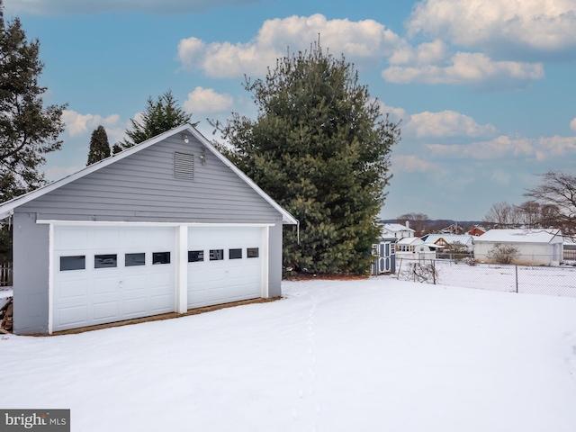 view of snow covered garage