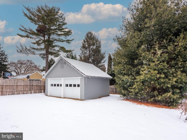 view of snow covered garage