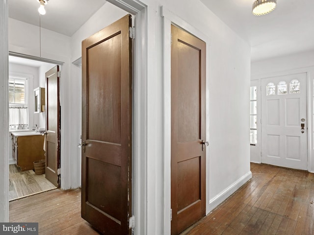 corridor featuring hardwood / wood-style flooring