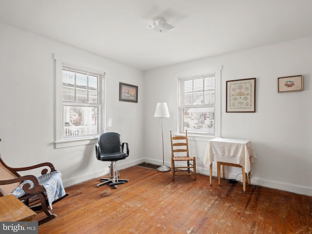 living area with hardwood / wood-style floors