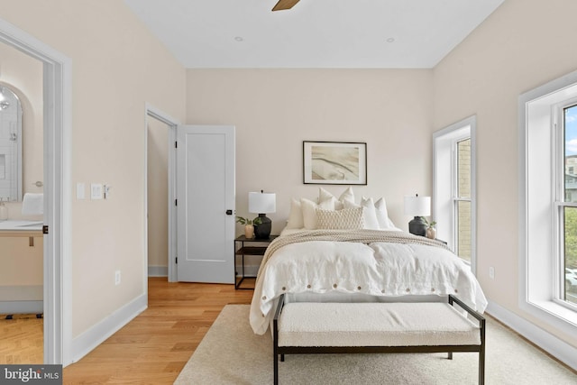 bedroom featuring ceiling fan and light hardwood / wood-style flooring