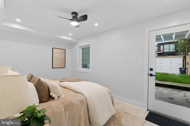 bedroom with light hardwood / wood-style flooring and ceiling fan