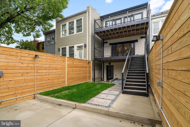 back of property with a patio