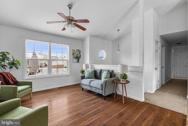 living room featuring ceiling fan, dark hardwood / wood-style flooring, and lofted ceiling