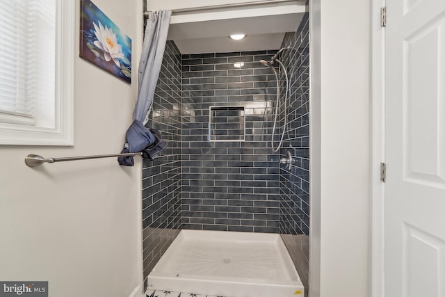 bathroom featuring curtained shower