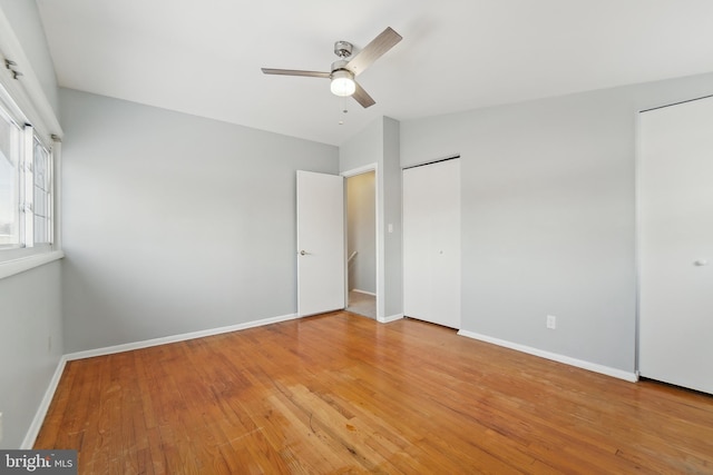 unfurnished bedroom featuring ceiling fan and wood-type flooring