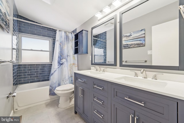 full bathroom featuring vanity, toilet, shower / bath combination with curtain, and tile patterned floors