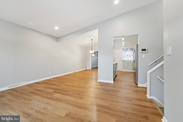 unfurnished living room with light wood-type flooring