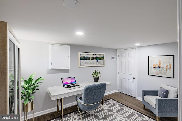 home office with hardwood / wood-style floors