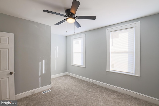 unfurnished room with light carpet