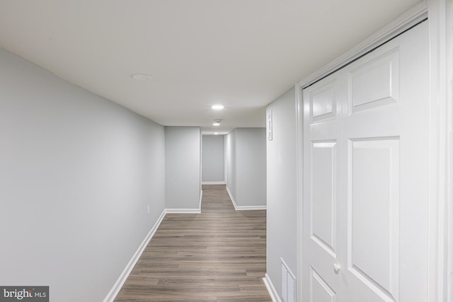 corridor with dark wood-type flooring