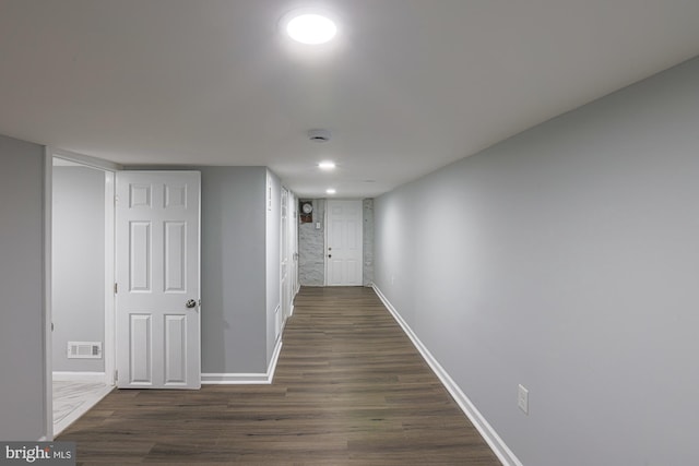 hall featuring dark wood-type flooring