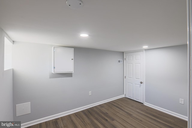 basement with dark wood-type flooring