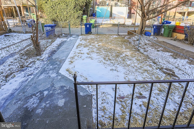 view of yard layered in snow