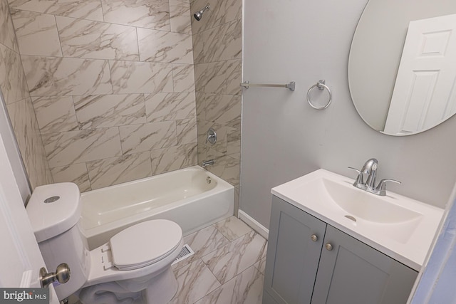 full bathroom featuring tiled shower / bath combo, vanity, and toilet