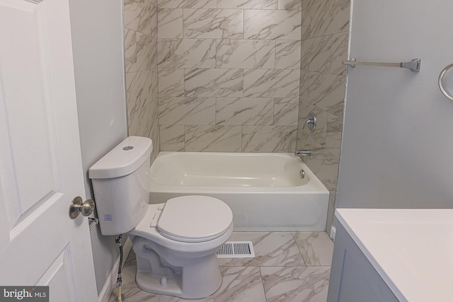 full bathroom featuring tiled shower / bath, vanity, and toilet