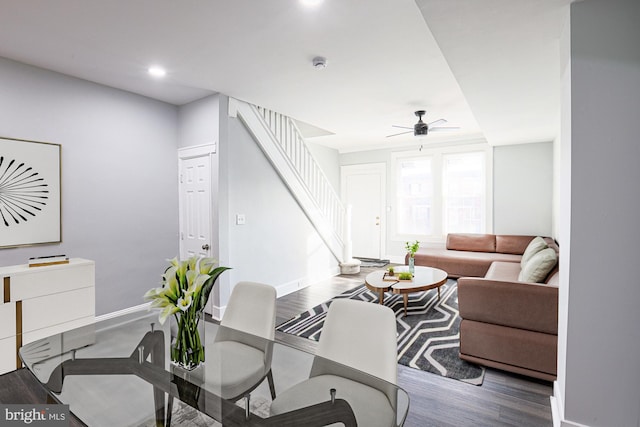 living room with ceiling fan and hardwood / wood-style floors