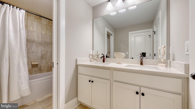 bathroom featuring vanity and shower / bathtub combination with curtain