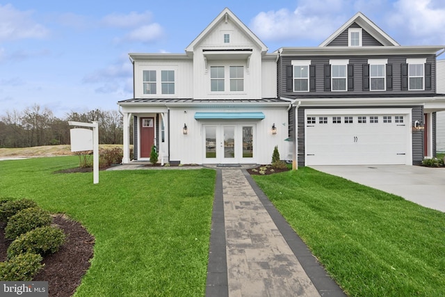 view of property featuring french doors, a garage, and a front lawn