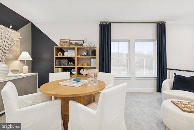 dining room featuring light colored carpet