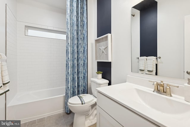 full bathroom featuring vanity, toilet, shower / bath combo with shower curtain, and tile patterned flooring