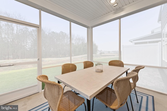 sunroom / solarium with wood ceiling