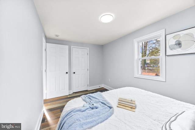 bedroom featuring dark wood-type flooring