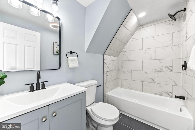 full bathroom featuring vanity, toilet, and tiled shower / bath combo