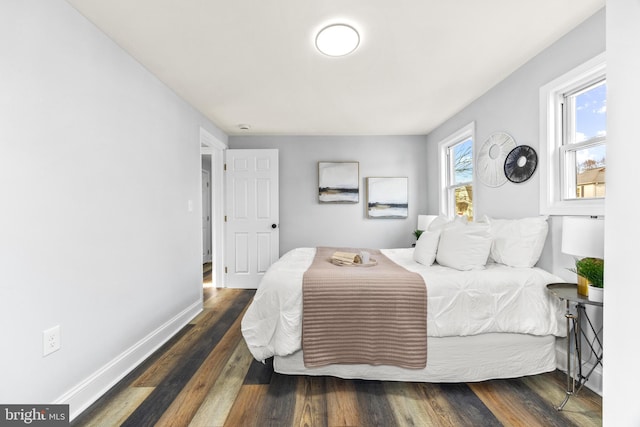 bedroom featuring dark hardwood / wood-style flooring