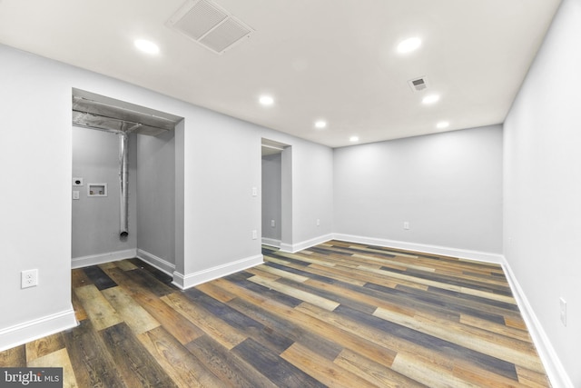 empty room with dark hardwood / wood-style floors