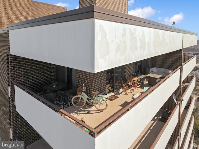 view of side of home featuring a patio area