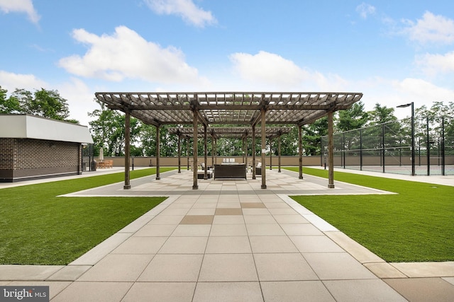 view of home's community featuring a yard, a pergola, and a patio area