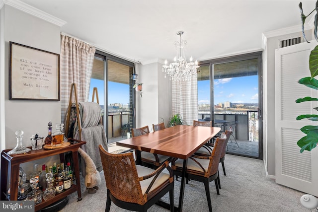 carpeted dining room featuring crown molding, a wall of windows, plenty of natural light, and a notable chandelier